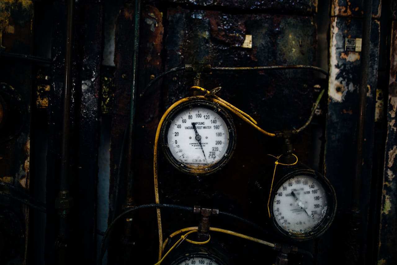 dials on a boiler, copper piping